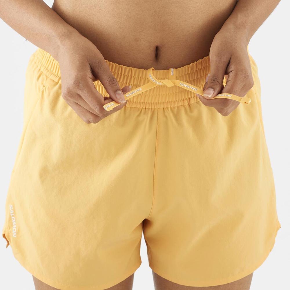 Spodenki Salomon Shakeout Core 2 In 1 4'' W Jasnopomarańczowe